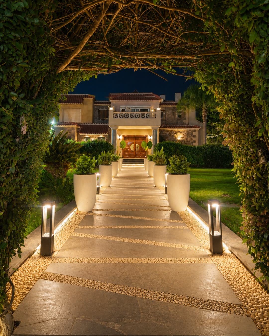 Lit garden entrance arch