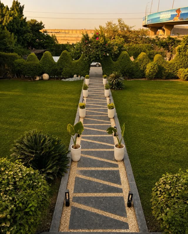 The garden path leading to the villa gate from the road